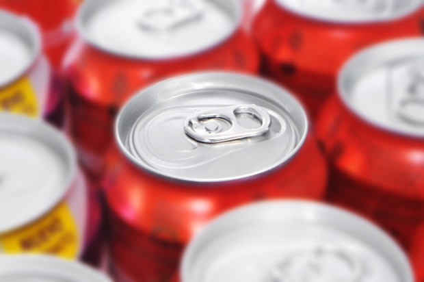 A close-up of soda cans, a beverage that can cause dental erosion.