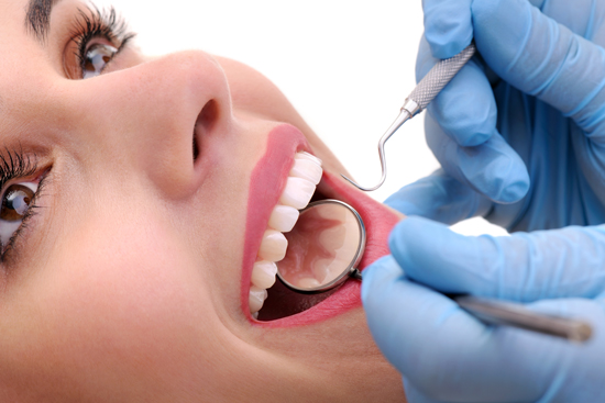 A dental examination reveals healthy gums resulting from laser treatment.